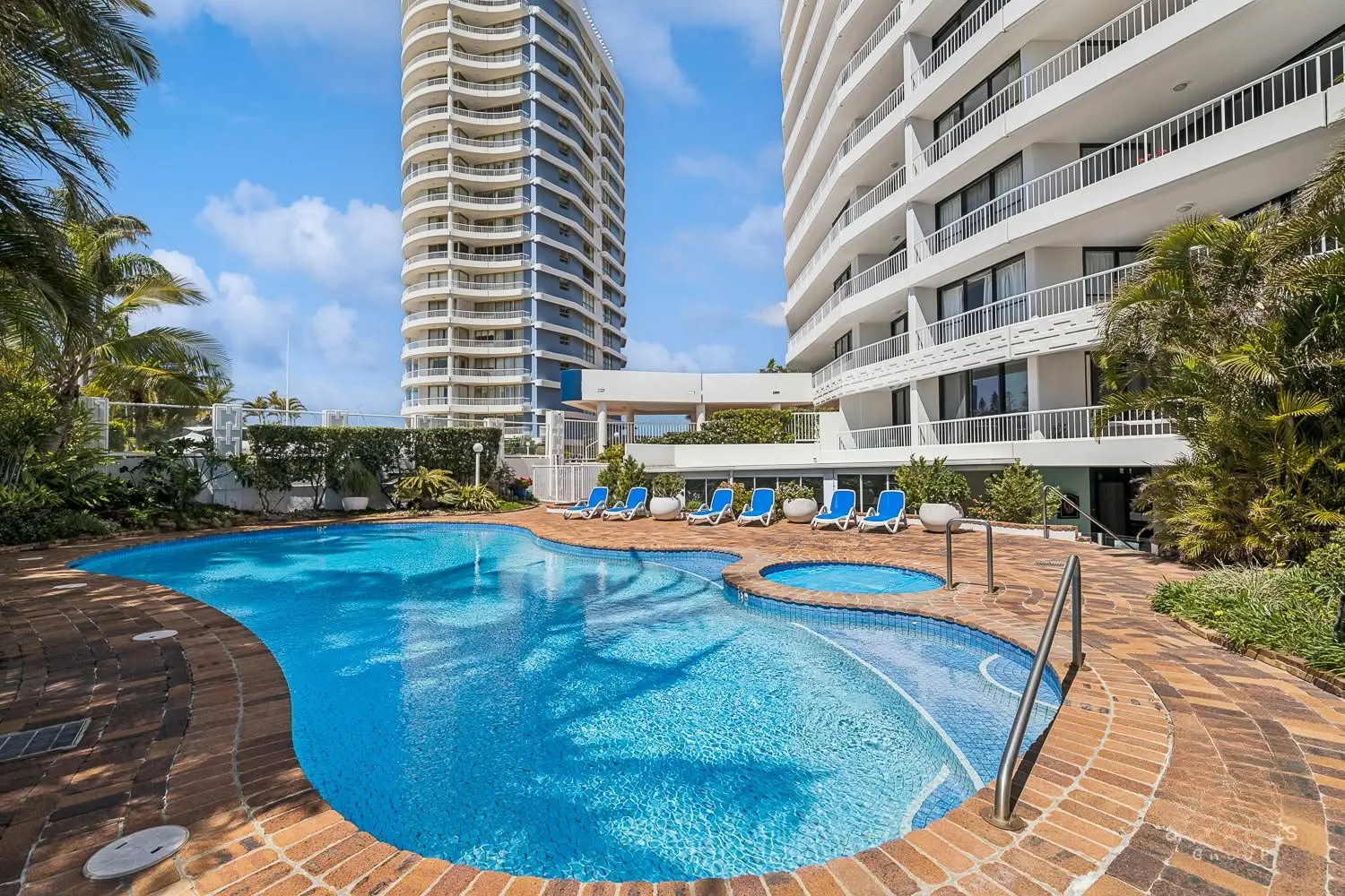 Leeward Tower heated pool and spa beside the tower in tropical gardens